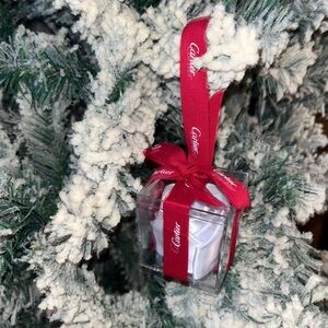 Cartier Red Ribbon ornament with ribbon rose inside.